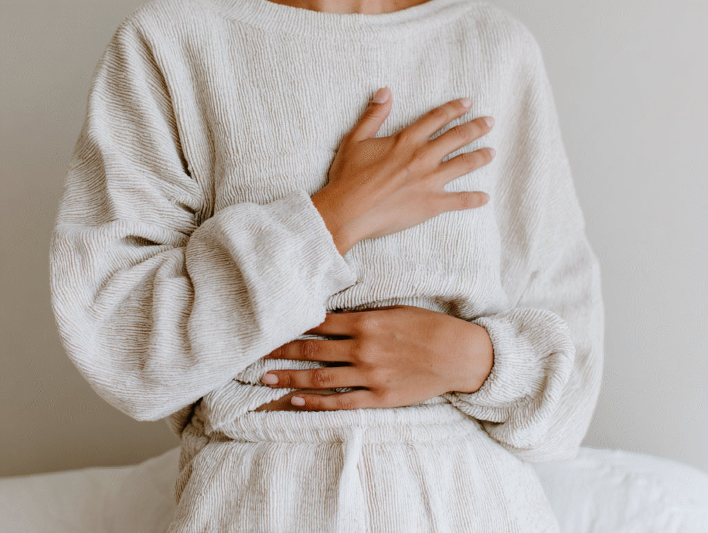 a woman holds her body in a high end lounge set