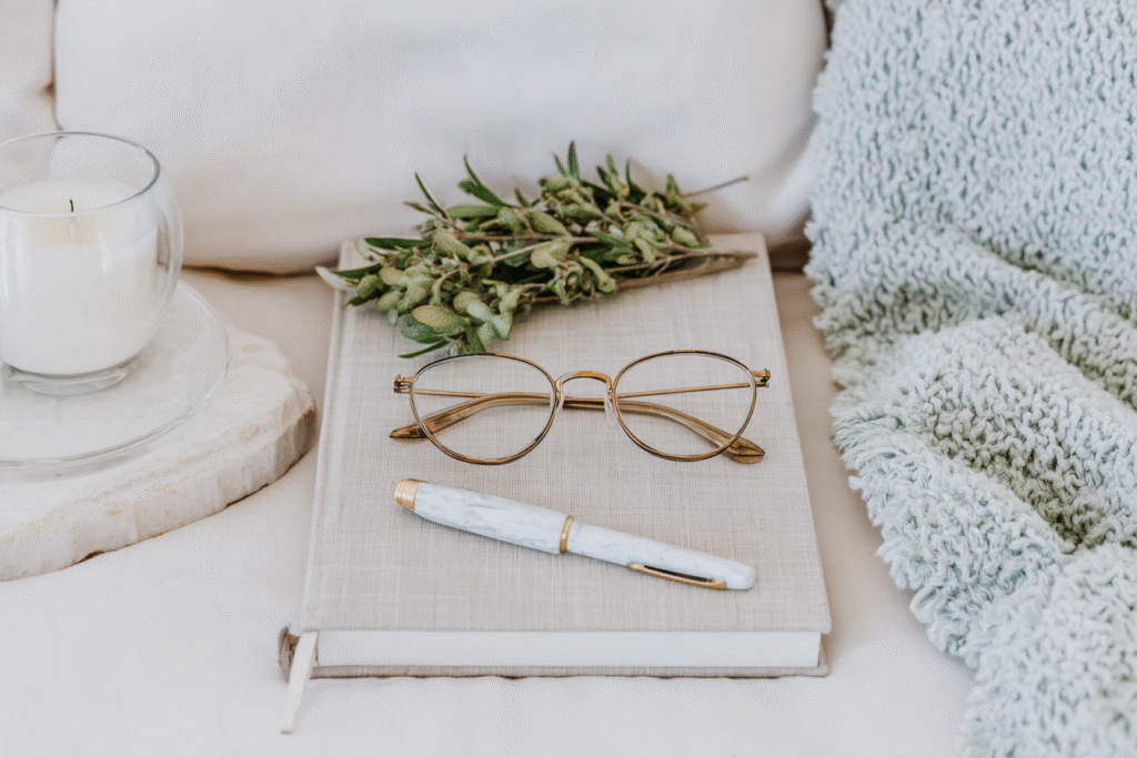 glasses sitting on top of a planner